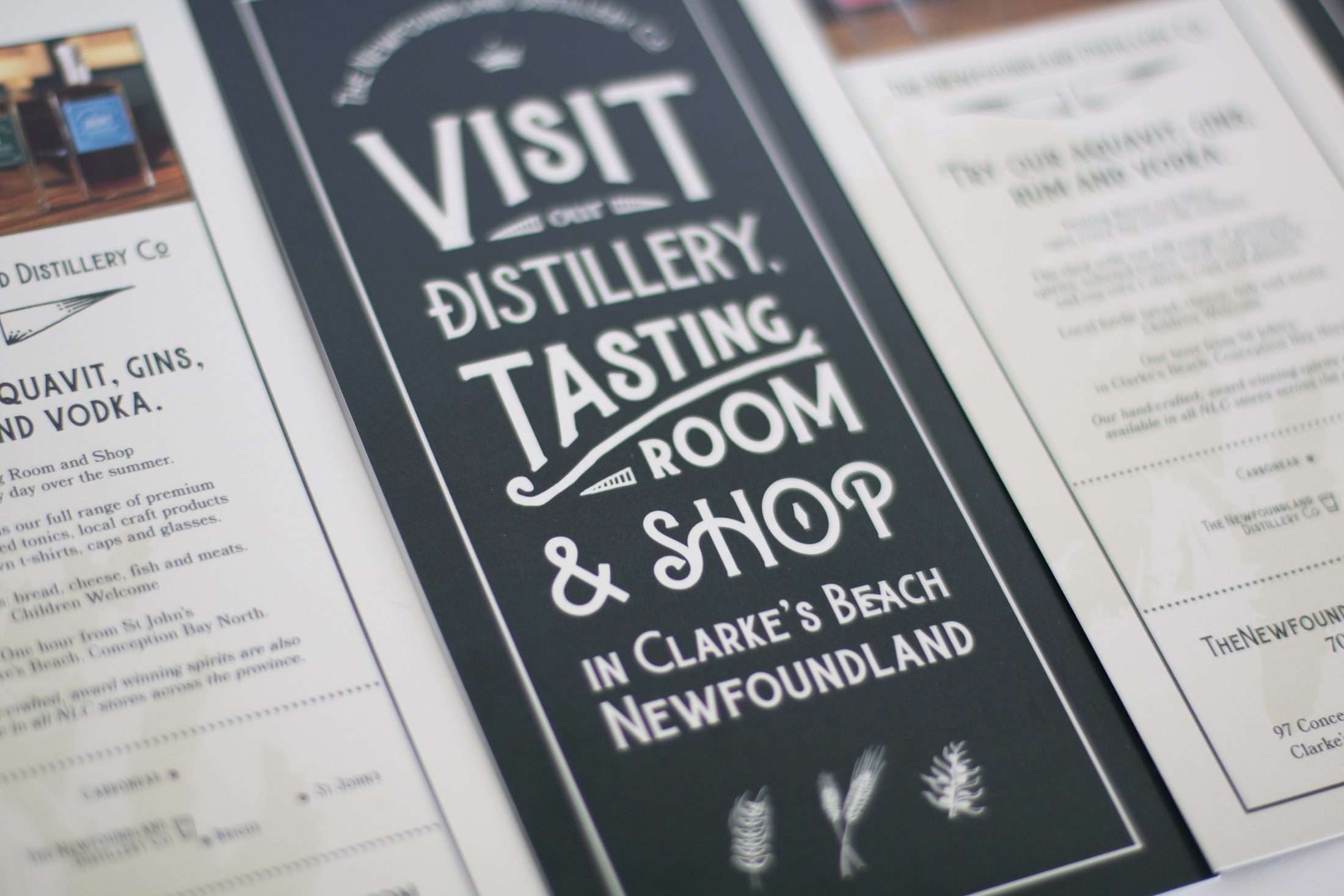 A closeup of a Newfoundland Distillery Company rack card inviting people to visit the tasting room and shop